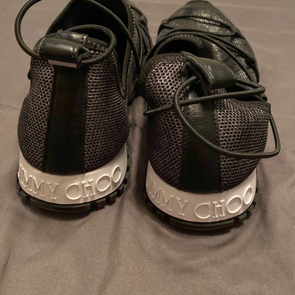Jimmy Choo slip ons.